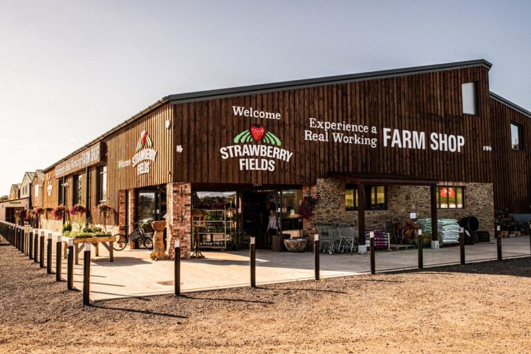 The outside of the Strawberry Fields farm shop bathed in sunshine.