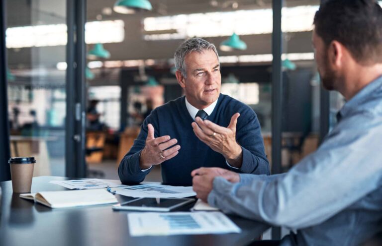 Colleagues in their office discussing an important matter.