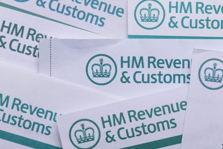 HMRC letterheaded papers overlapping each other.