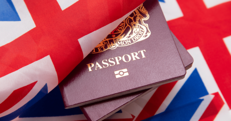 Image of a British Passport and between two Union Jack flags.