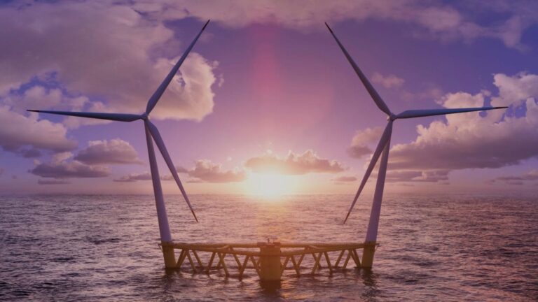 A floating wind turbine platform in the sea at sunset.