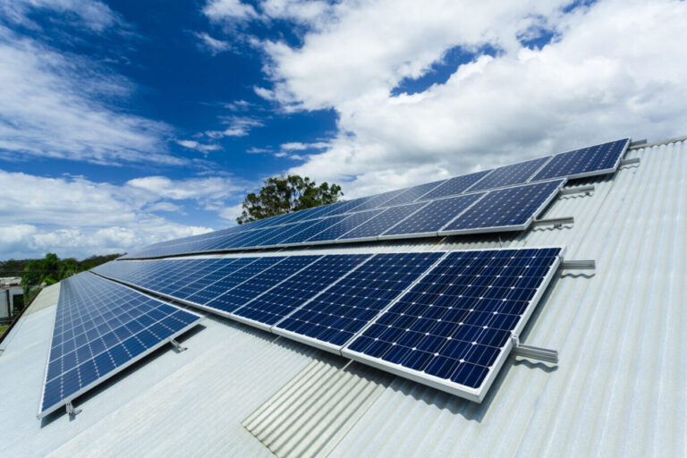 Energy solar panels on corrugated roof.