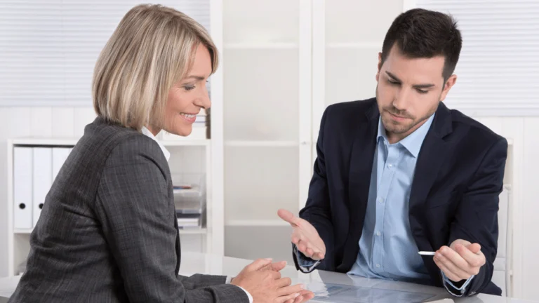 Colleagues in their office discussing a strategy