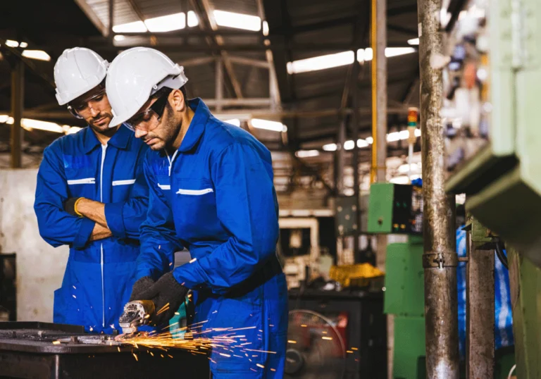 Two men are working in a manufacturing workshop