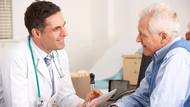 A patient discussing something medical with a doctor.