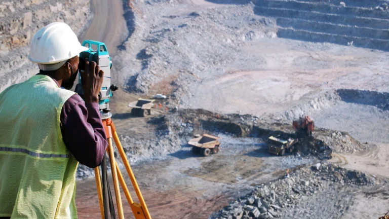 Man with camera surveying a quarry