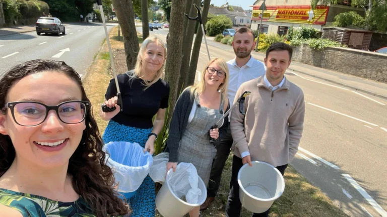 Colleagues litter picking on volunteering day