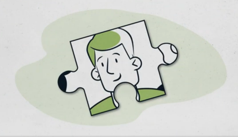 A drawn face on a piece of jigsaw video screenshot.