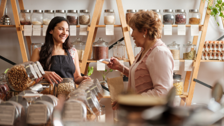 Two ladies talking in a zero-waste food shop.