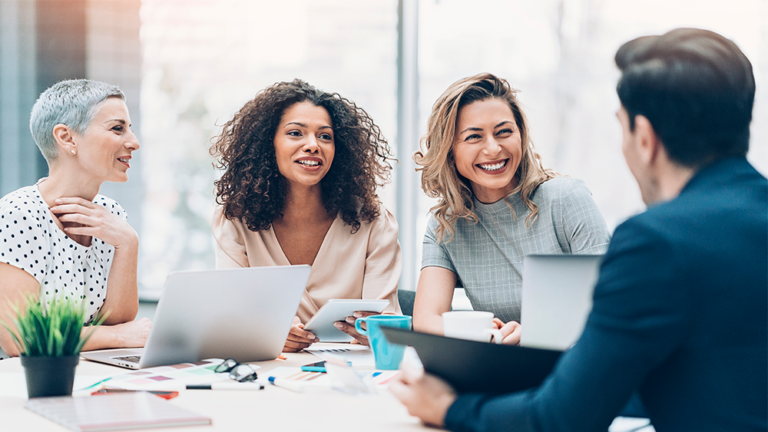 Group of people smiling in office