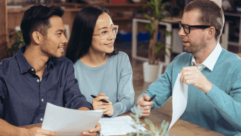 A casual business meeting between three people