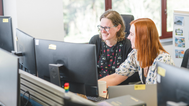 Two women colleagues working together.